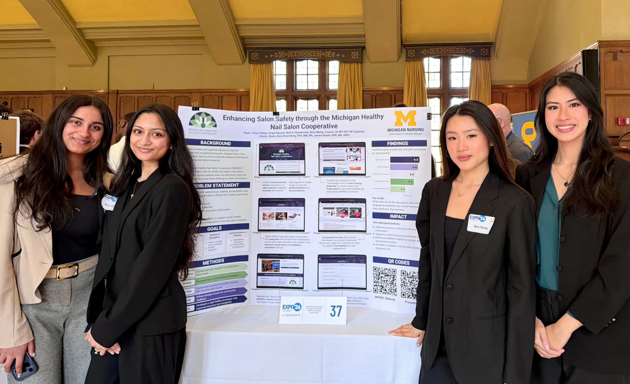 Our four-person team standing beside our research poster, “Enhancing Salon Safety through the Michigan Healthy Nail Salon Cooperative,” at the UMSI Expo.