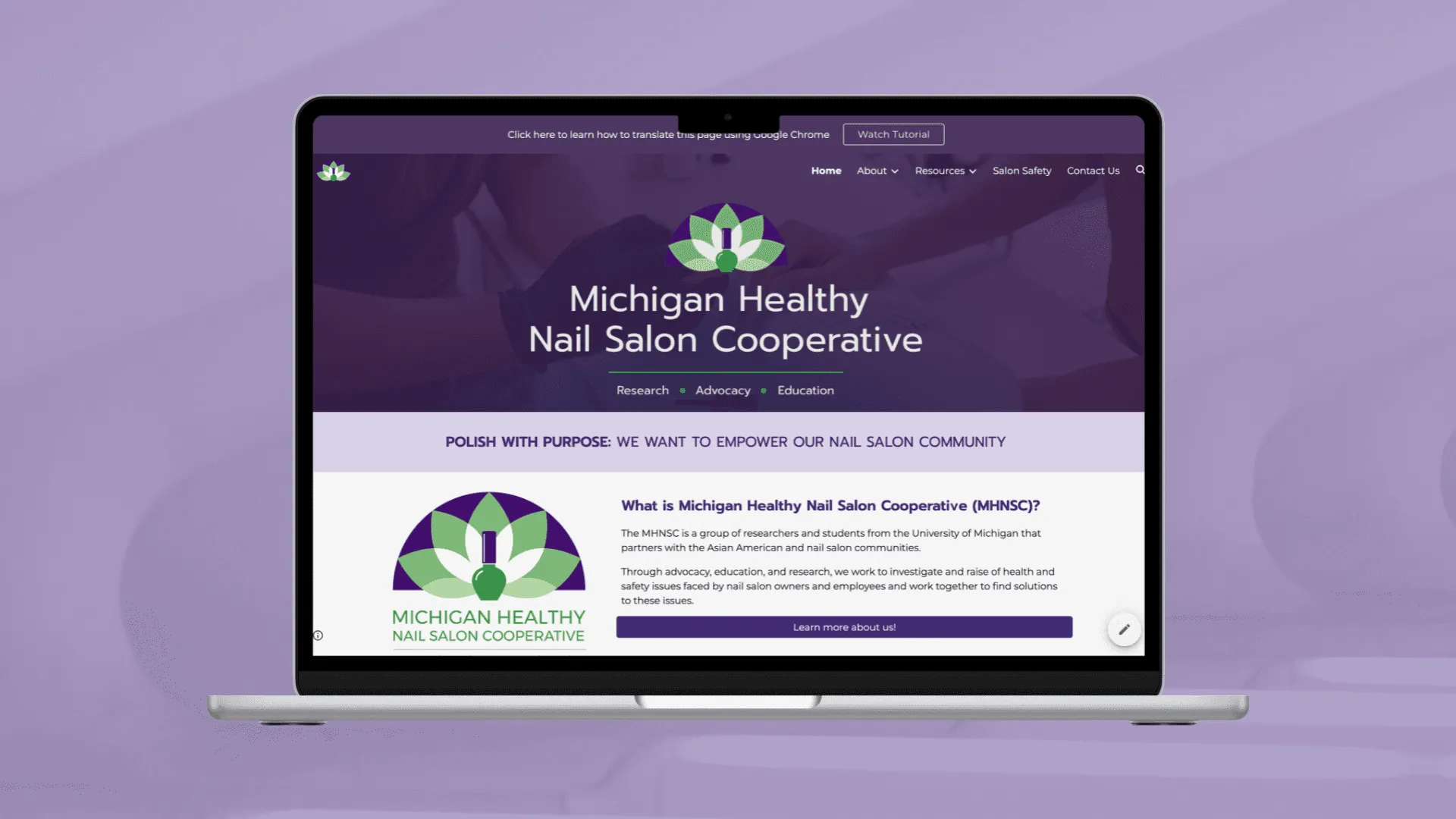 Laptop showing the Michigan Healthy Nail Salon Cooperative homepage, with its purple and green lotus logo.